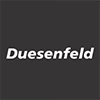 White text Duesenfeld in bold italics on a dark grey background.