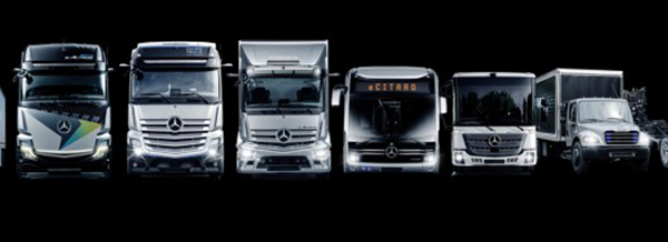 Six Mercedes-Benz lorries and buses are lined up side by side against a black background.
